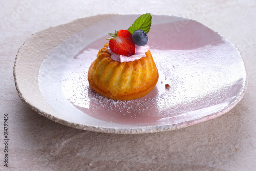 Mini Bundt Cake garnished with berries photo