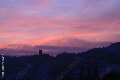 lila rosa sunset in the mountains and castle photo