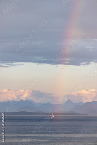 Sailboat under rainbow in British Columbia