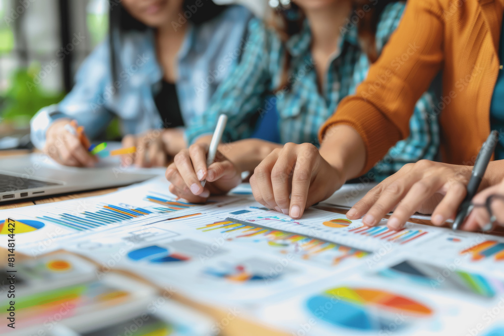 Hands business team having a meeting to analyze data graph charts for a marketing plan. Hands business team having a meeting to analyze data graph charts for a marketing plan.