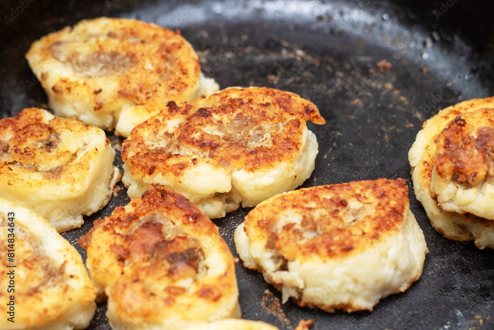Meat sizzling in a frying pan for a delicious dish Meat sizzling in a frying pan for a delicious dish
