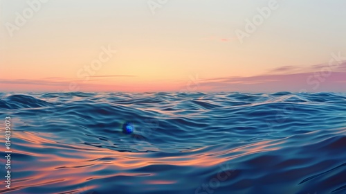 Tranquil seascape with rippling waves reflecting gradient sky suggesting peace