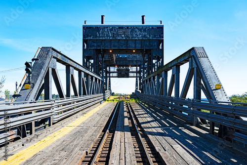 An old railroad ramp in Nanaimo, Canada, which allows wagons to be loaded onto ships or ferries. Despite being old the tracks are shiny so still in use. photo