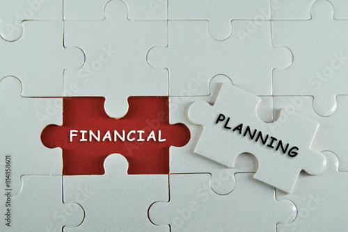 Piece of jigsaw puzzle with words Financial Planning.