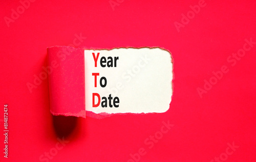 YTD year to date symbol. Concept words YTD year to date on beautiful white paper. Beautiful red paper background. Business YTD year to date concept. Copy space. photo