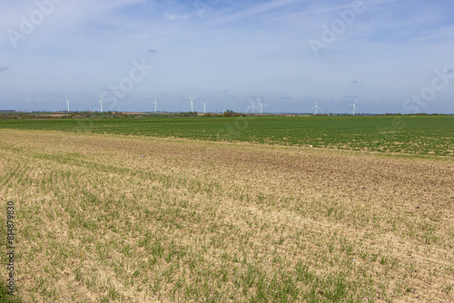 Fields waiting to be tilled, near the Liege area with windmills in the background