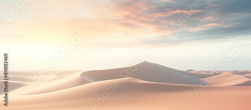 Evening sun illuminates the small sand dunes on the beach creating a picturesque scene with ample copy space for a captivating image