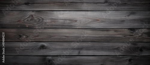 A wallpaper featuring a textured dark gray wooden surface that provides a copy space image