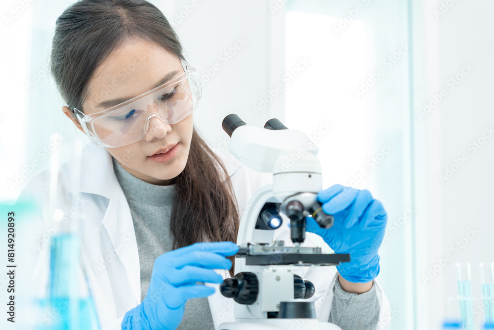 Scientist analyze biochemical samples in advanced scientific laboratory. Medical professional use microscope look microbiological developmental of viral. Biotechnology research in science lab. Scientist analyze biochemical samples in advanced scientific laboratory. Medical professional use microscope look microbiological developmental of viral. Biotechnology research in science lab.
