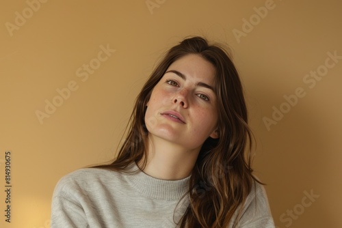 Woman in Beige Sweater, Beige Background. Generative AI. © Tuyres