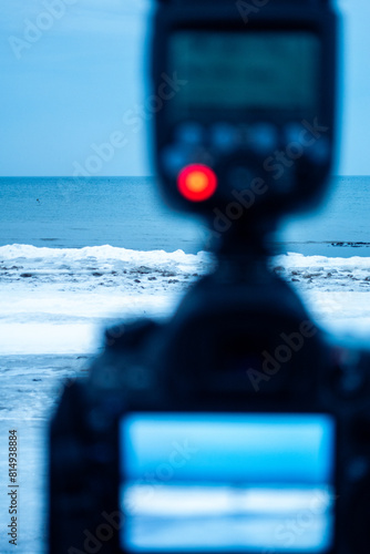 close up of a camera on a seaside