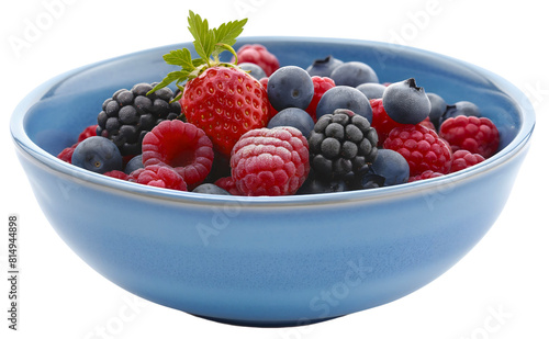 Closeup of blue ceramic bowl with strawberry  blueberry and raspberry organic fresh healthy fruits mix full of vitamins  object isolated on transparent background. Delicious summer snack