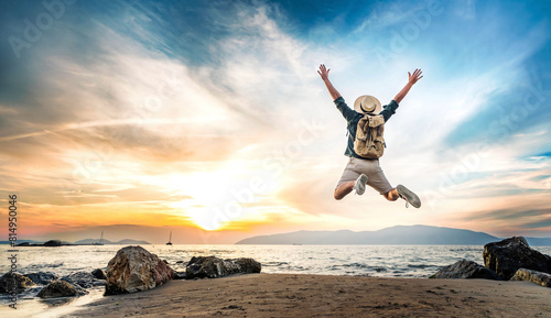 Happy tourist enjoying sunset on the beach - Successful man jumping outside - Summertime holidays concept with joyful guy walking outdoors - Colorful filter
