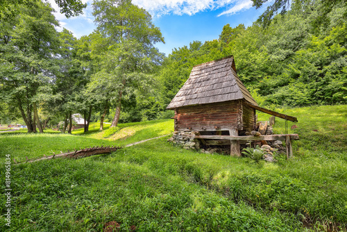 Amazing summer scene of traditional romanian peasant houses.