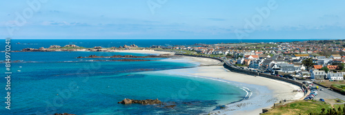 Aerial panoramic view of Cobo Bay, sandy beach landscape panorama in Guernsey, Channel Islands web banner photo