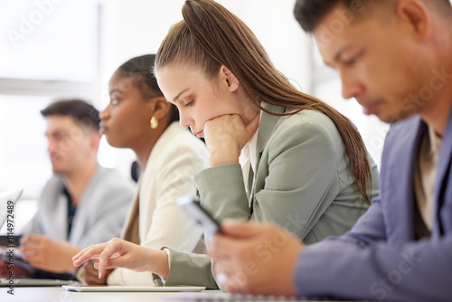 Boring, meeting and team with tablet in office typing notes from workshop or planning schedule. Tired, employee and people in workplace with tech for research or reminder for corporate training photo