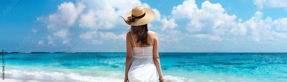 Standing on the shore, the warm sun on her skin and the sound of the waves crashing behind her, she gazes out at the endless ocean, dreaming of all the possibilities that lie ahead