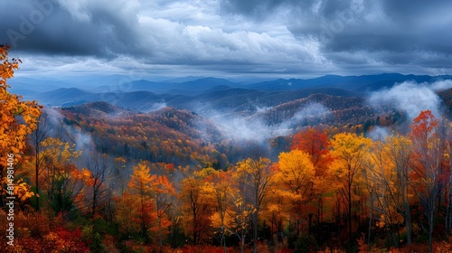 Swirling Grey Clouds Part to Unveil Vibrant Autumn Forest in the Smokies © Sawitree