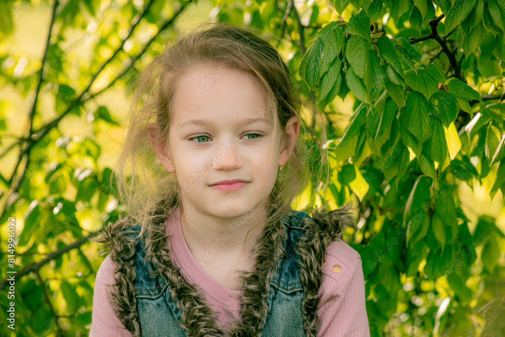 Portrait of a young girl with a gentle gaze, surrounded by lush green leaves, highlighted by soft sunlight. Portrait of a young girl with a gentle gaze, surrounded by lush green leaves, highlighted by soft sunlight.