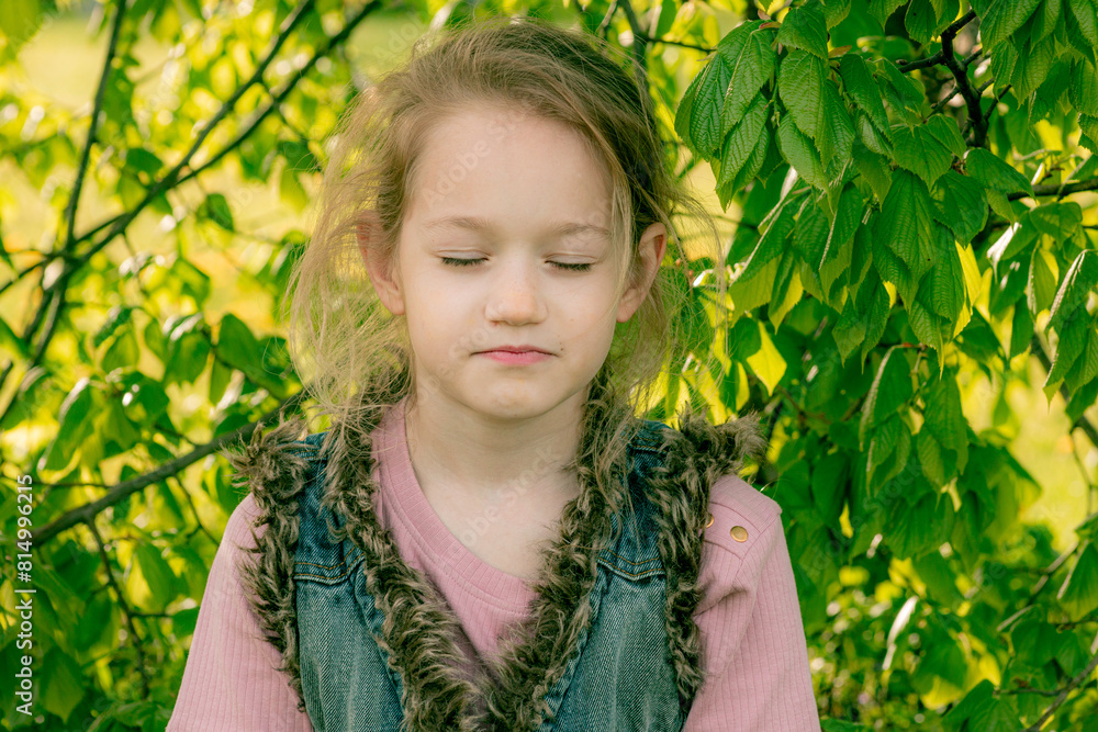 A young girl meditating in a lush green garden, sitting cross-legged under a canopy of leaves. A young girl meditating in a lush green garden, sitting cross-legged under a canopy of leaves.