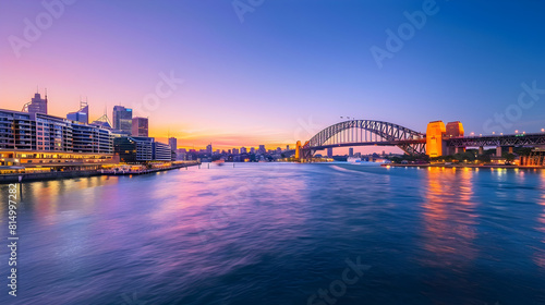 Mesmerizing Evening View Of A Historical Coastal City With Iconic Bridge