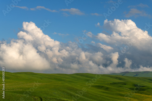 Picturesque clouds over a high mountain plateau on a spring evening