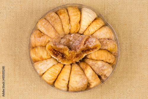 Dried figs in round packaging on textile napkin, top view © An-T