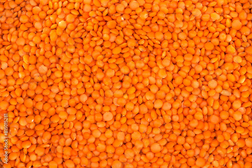 Background of surface of raw whole red lentil on heap © An-T