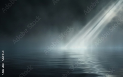 Beam of light piercing through misty darkness on a reflective surface.