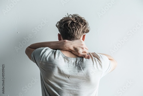 Young Man Experiencing Neck Pain at Home.