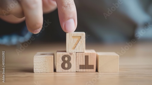 Concept of interest rate and financial rates. Hand placing a wooden cube block on top, symbolizing an increasing trend, with an upward direction icon and percentage symbol. hyper realistic  photo