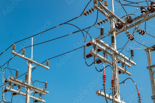 electrical wires with insulators on concrete pillars
