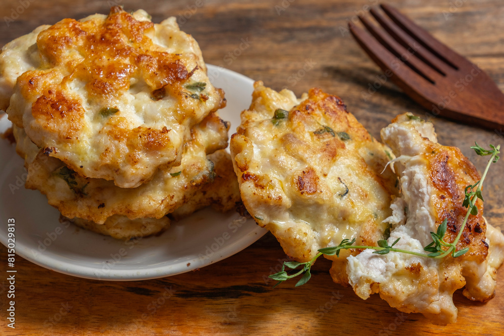 Chicken cutlets or patties for tasty snack on wooden background. Chicken cutlets or patties for tasty snack on wooden background.