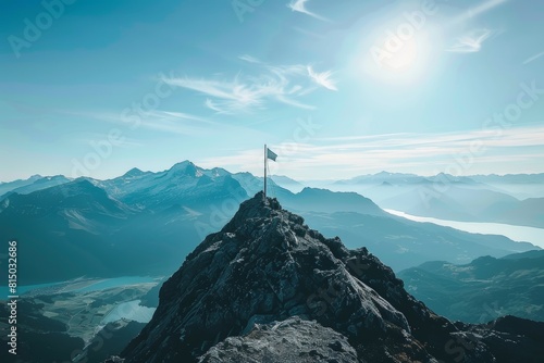 Summit Success: Flag on Mountain Peak Symbolizing Achievement and High Business Goals