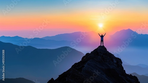 A person  standing with arms raised on a mountain peak at sunrise  embodies the success of achieving personal goals and resolutions in 2025. 2025 new year resolutions