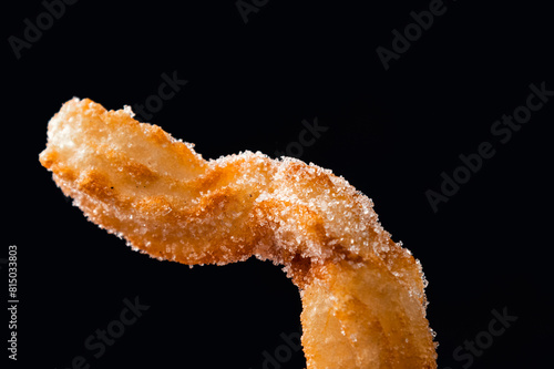 close-up of hot crocane flour churros fried in oil