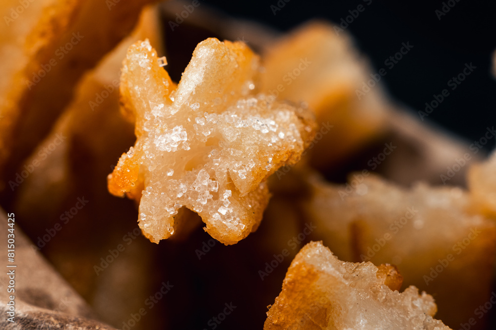 close-up of hot crocane flour churros fried in oil close-up of hot crocane flour churros fried in oil