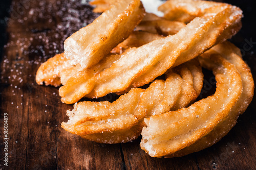 close-up of hot crocane flour churros fried in oil