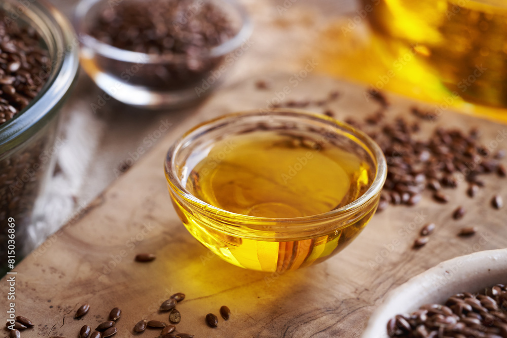 A bowl of flax seed oil on a table A bowl of flax seed oil on a table