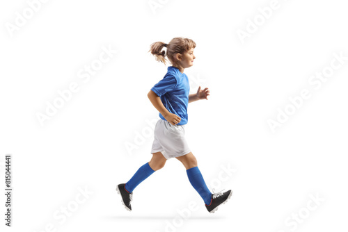 Full length profile shot of a girl in a football jersey running
