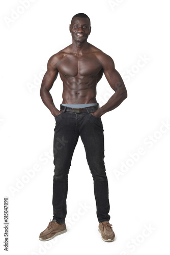 portrait of shirtless man with hands in pockets on white background