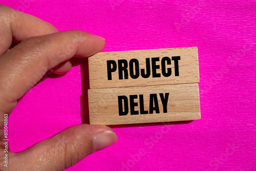 Canvas Print Project delay words written on wooden blocks with pink background