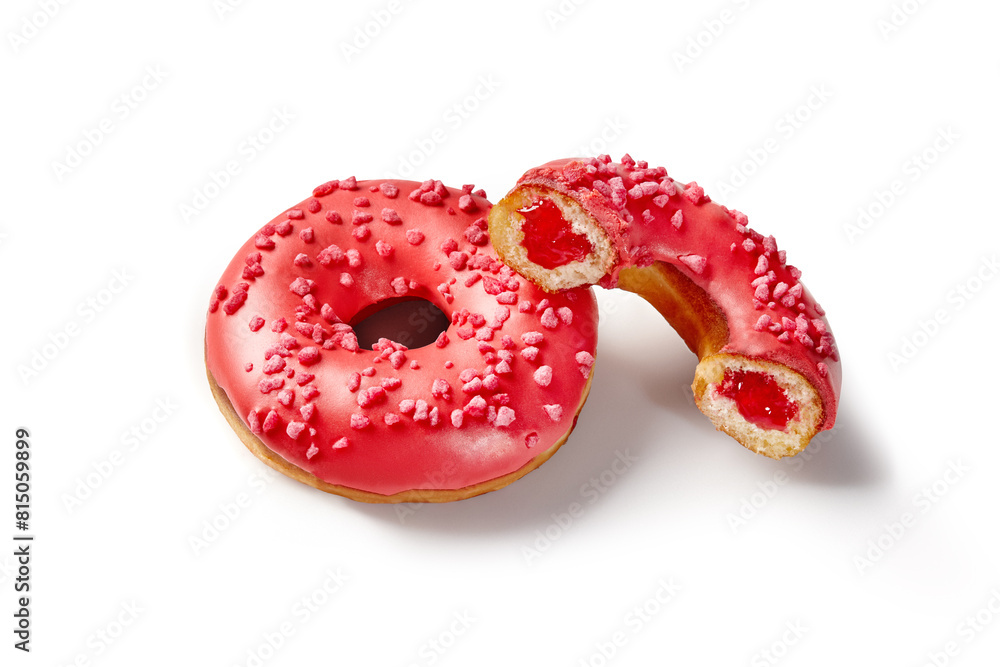 Red glazed donuts with berry jelly filling and sprinkles Red glazed donuts with berry jelly filling and sprinkles