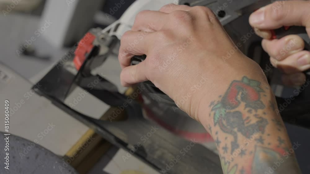custom made wallpaper toronto digitalThis video shows a close up view of tattooed hands using a rotary saw to cut through wood. 