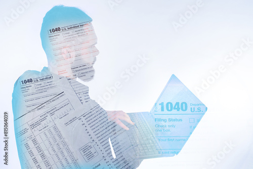 Tax return form 1040. Man with laptop. US tax system. Electronic filing of 1040. USA individual income declaration. Guy fills out tax documents. Accountant prepares financial statement for client. photo