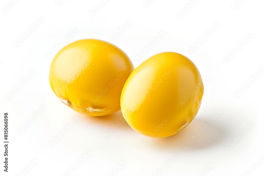 two yellow eggs sitting on top of a white surface two yellow eggs sitting on top of a white surface