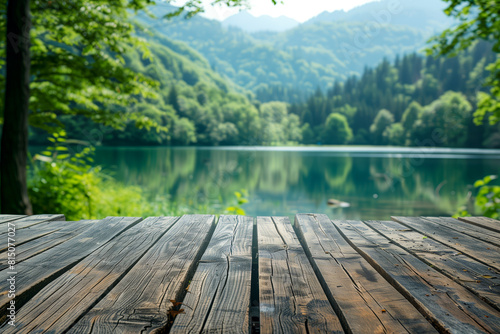 A wooden table with a lake background