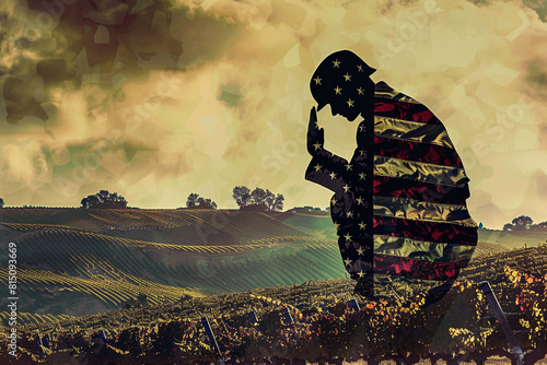 Praying soldier silhouette from an American flag against rolling vineyards for Memorial Day. photo