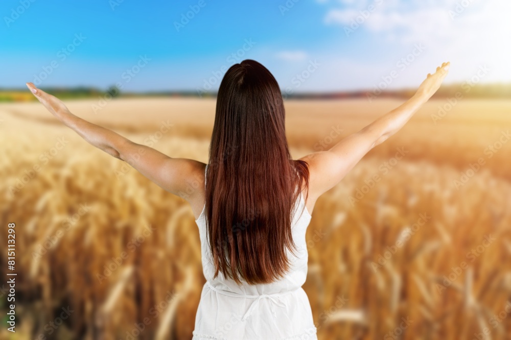 Young woman in meadow relax at sun Young woman in meadow relax at sun