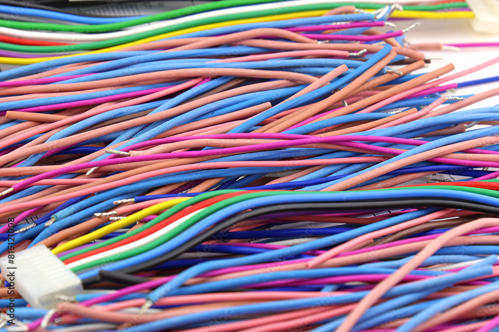 Copper electrical wiring wires in colored insulation for connecting electrical equipment. Close-up. Soft focus.